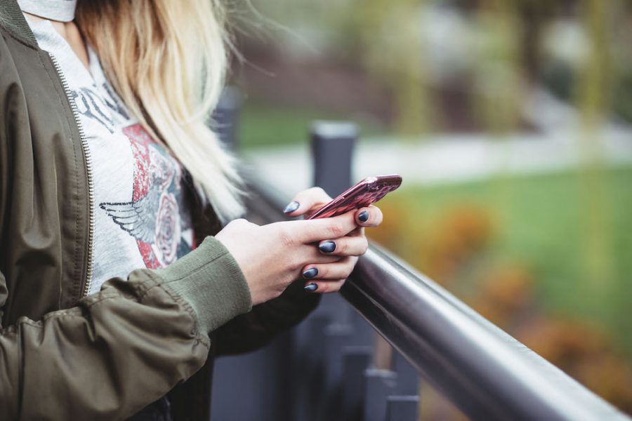 Woman texting with her cell phone.